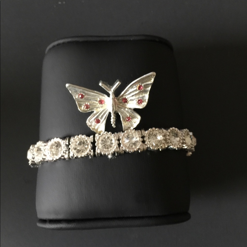 Butterfly brooch and silver stretch bracelet